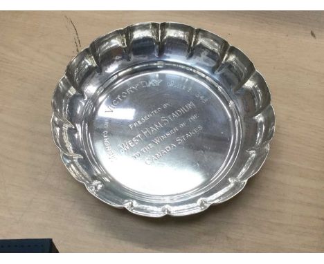 Silver dish with scalloped sides snd commemorative inscription 'Memento of Victory Day June 1946, presented by West Ham Stadi