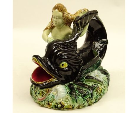 20th Century Majolica Pottery Figurine "Siren And Dolphin". Unsigned. Light crazing, small loss or in good condition. Measure