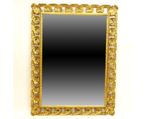 Vintage Italian Carved Giltwood Mirror. Unsigned. Light wear and rubbing or good condition. Measures 41" x 31". Provenance: C