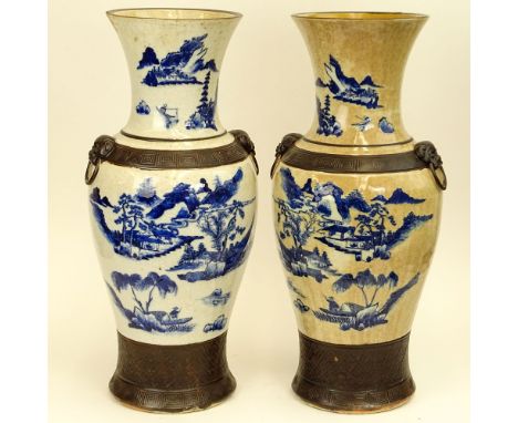 20th Century Chinese Guangxu style pottery vases with raised enamel foot, bands and mock figural ring handles. Signed with in
