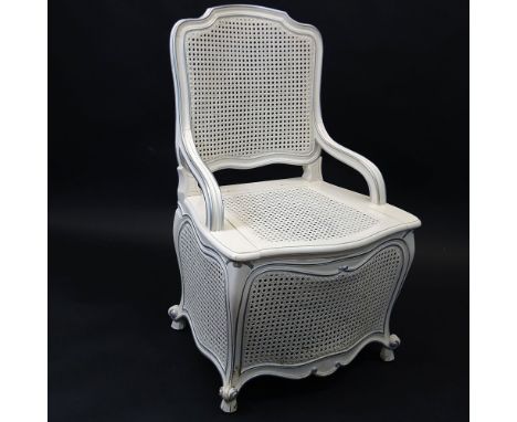 Vintage Louis XV style caned toilet/potty chair. Unsigned. Light scratches and rubbing. Measures 36" H x 22-1/2" W x 19" D. P
