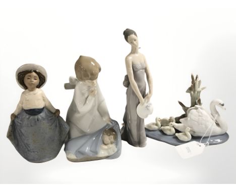 Three Lladro figures numbers 5722, 4635 and 5598 and a Nao figure 11041,all boxed 