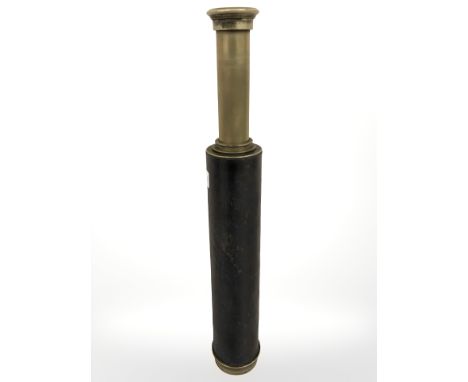 An antique brass and leather mounted telescope.