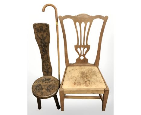 A carved oak spinning chair, a further chair and a walking stick.