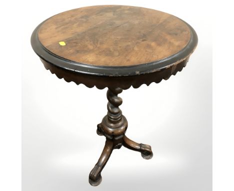 A Victorian rosewood and ebonised circular tripod occasional table, diameter 53 cm.