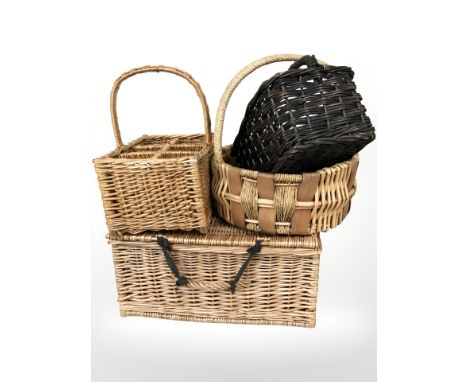 A wicker picnic hamper and three baskets, largest 52 cm wide.