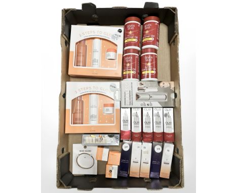 Two Glow formula skincare sets, Formula face oils and serums, bottles of Olay serum, River Island bangle, Seven Seas suppleme