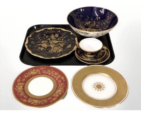 A Minton porcelain fruit bowl on blue ground, similar plate, tea cups and saucers, two further Minton plates 