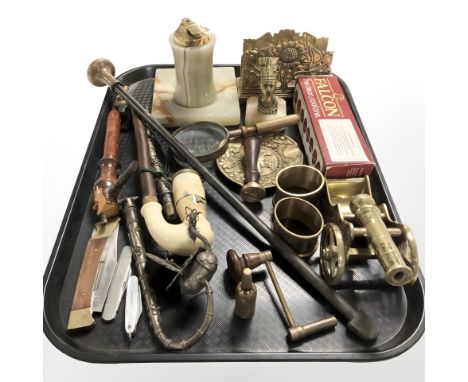 A brass and onyx table lighter and matching ashtray, pipes, folding knives, miniature brass cannon, etc.