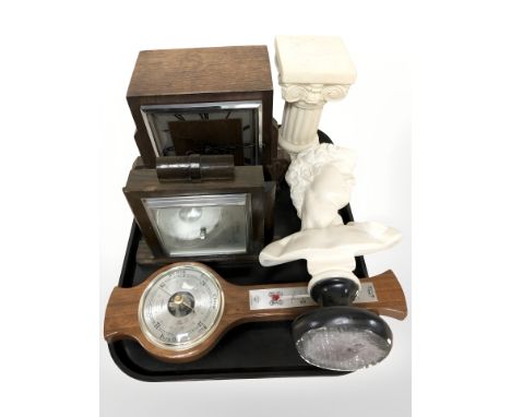 A plaster bust of David, a resin corinthian column, two Art Deco mantel clocks and a barometer.
