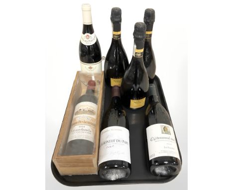 Seven various bottles of alcohol including Chateauneuf du pap, Valdo prosecco.