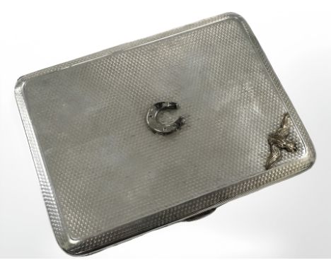 A silver cigarette case with applied RAF emblem and horseshoe, Chester 1929. CONDITION REPORT: 150.2g