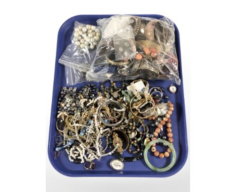 Assorted costume bracelets, bangles, necklaces, a Chinese nephrite bangle, simulated pearls, etc.