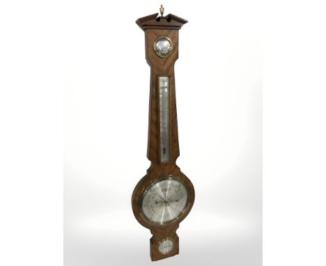 A Chippendale style mahogany mirror and a reproduction barometer 