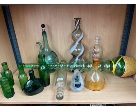 A Shelf of collectables glass bottles and art glass; Pyrex glass rolling pin and ornate cut glass paperweight signed Svaja 