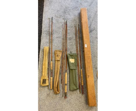 Three vintage fly rods and bags together with a wooden carry case; Hardy brothers two piece fly rod and bag, Three piece spli