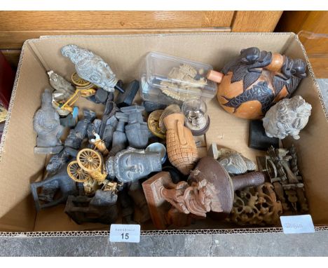 A box of far eastern items to include; stone figurines, busts, and carved display pieces, Buddha Deity head sculptures, Terra