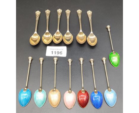 A Set of eight Birmingham silver and enamel coffee spoons with a gilt finish. Together with a set of Six Birmingham silver co