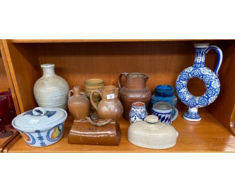 Shelf of collectable pottery and stoneware; Italian Blue glaze vase, Salt glaze stoneware waterjugs and flagons, Buchan Potte