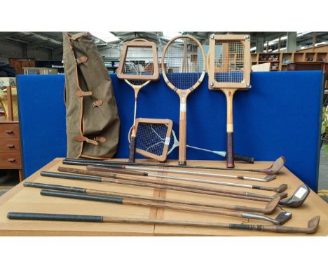 Vintage badminton rackets within a bag along with hickory shafts.  Includes a Tom Grant St Andrews mashie club and Niblick Sc