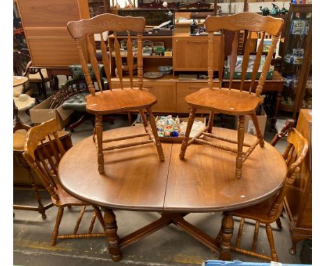 Ercol style elm wood dining table with four chairs 