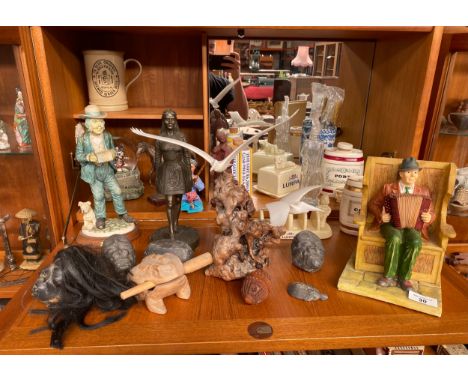 A large collection of mixed collectables to include musician figures, Lurpak butter and toast rack, Wade Pottery barrel decan