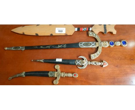Three replica dagger letter openers with sheaths and African tribal wooden dagger 