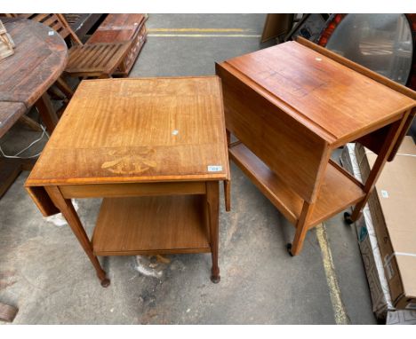 Edwardian inlaid floral design drop end side table of two tiers. Together with a light wood trolley table of two tiers. 