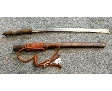 Antique Burmese sword; Brass and shagreen handle, Wood and brass bound scabbard and engraved panels to blade. [68cm in length