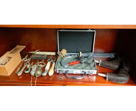 Shelf of various ornate handled JAW Harps and various odds