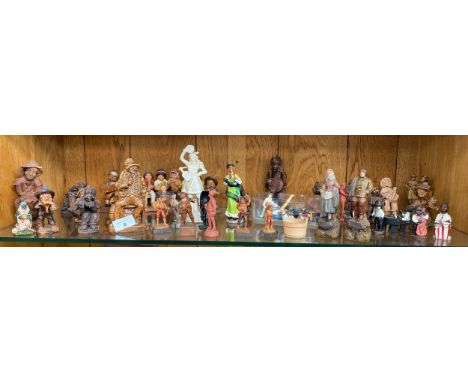 Shelf of various figurines to include figures of a musical theme