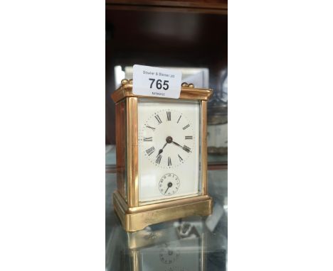 Antique brass carriage clock with bell alarm movement. 