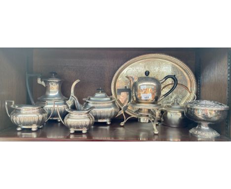 Shelf of silver plated items; tea/ coffee service, spirit kettle and serving tray etc 