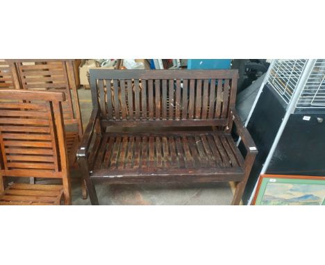 Dark stained garden bench 