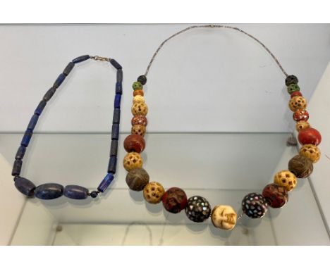Vintage Oriental bead worked necklace. Designed with an Oni mask carved bead. Together with a lapis Lazuli bead necklace. 