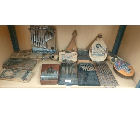 Shelf of various thumb pianos