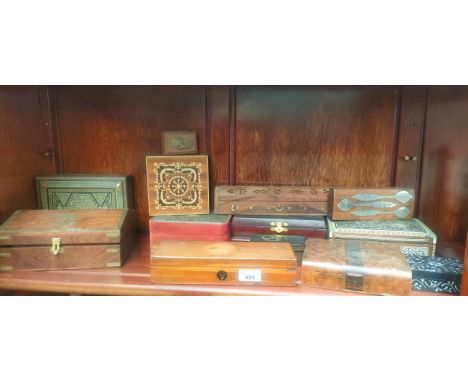 Shelf of various wooden storage boxes