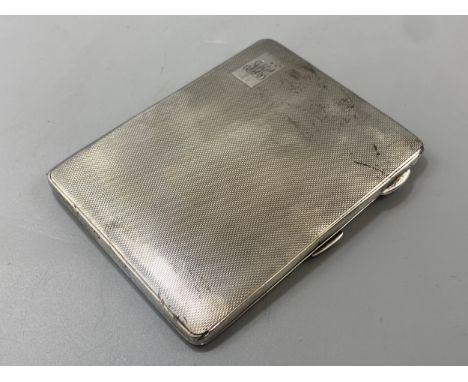 A silver cigarette case with inside engravings hallmarked Birmingham 1943, weight 150 grams 