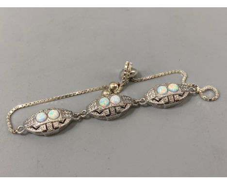 A silver CZ and opal bracelet, weight 10.47 grams 