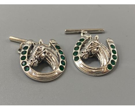 A pair of silver and Emerald horse shoe cufflinks, weight 8.6 grams 