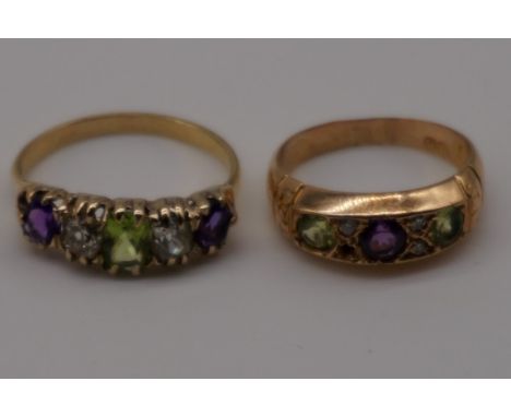 A Suffragette five stone gold ring, tests as 18ct, set amethyst, peridot and diamond; together with&nbsp;a gypsy set example,