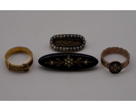 A small collection of mourning jewellery, comprising; a plaited hair and enamel gold ring, stamped 9ct; a plaited hair unmark