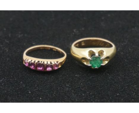 An amethyst gypsy set gold ring, hallmarked 15ct; together with an emerald set example, stamped 585. 