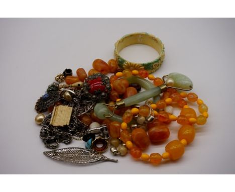 A quantity of costume jewellery;&nbsp;together with a pale jadeite bangle etc. 