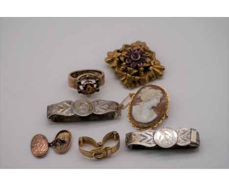 An oval carved cameo gold brooch/pendant, stamped 9ct; together with an unmarked amethyst brooch; and four scarf clasps etc. 