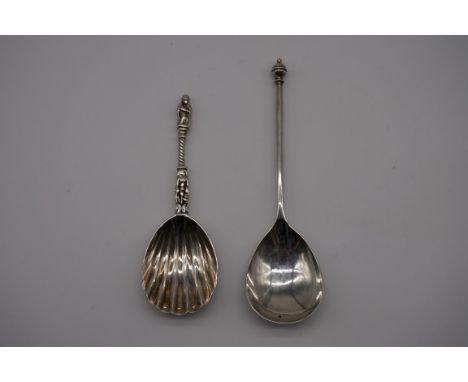 A Victorian silver apostle caddy spoon, makers mark indistinct, London 1874, 10.5cm; together with a silver spoon, by Harrods