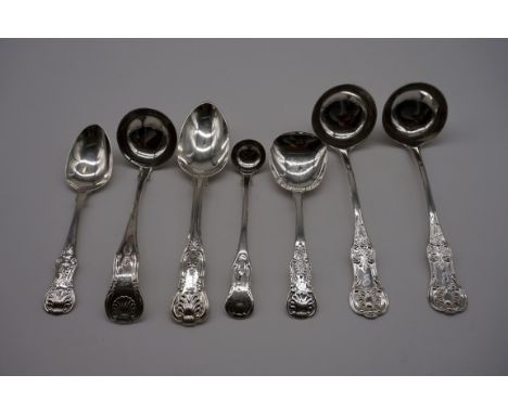 A small collection of silver Kings pattern spoons, comprising; a dessert spoon, Exeter 1849; a George III sauce ladle, Edinbu