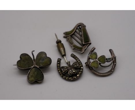 Two moss agate silver 'shamrock' brooches; together with a similar Irish harp example; and a marcasite shamrock and horseshoe