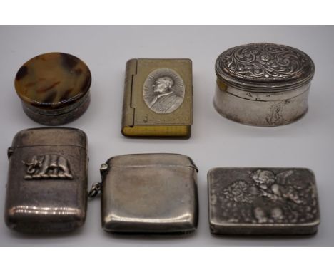 A Victorian silver vesta case, London 1881, having elephant applique; together with a similar plain example; a silver snuff b