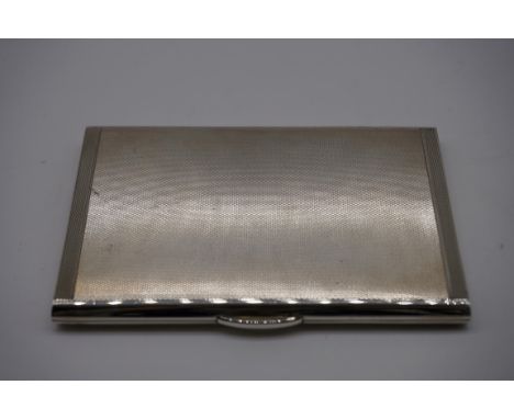 An engine turned silver cigarette case, by A Nicholls &amp; Son, London 1946, 11.5 x 8cm, 183g gross weight. 